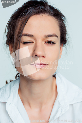 Image of The young woman\'s portrait with thoughtful emotions