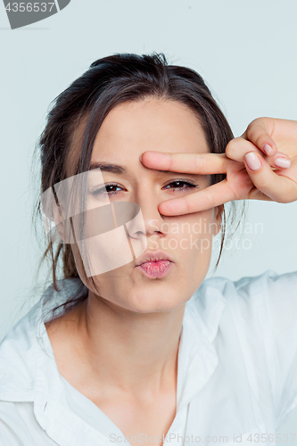 Image of The young woman\'s portrait with thoughtful emotions