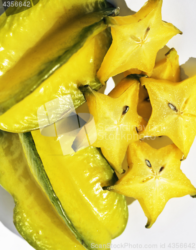 Image of delicious carambola asian exotic fruit on white background isola