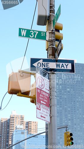 Image of Street signs at West 37th Street and 10th Avenue