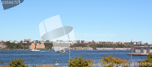 Image of Ferry and work boat navigating the Hudson River 