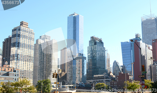 Image of Skyscrapers and apartment buildings at intersection in New York 