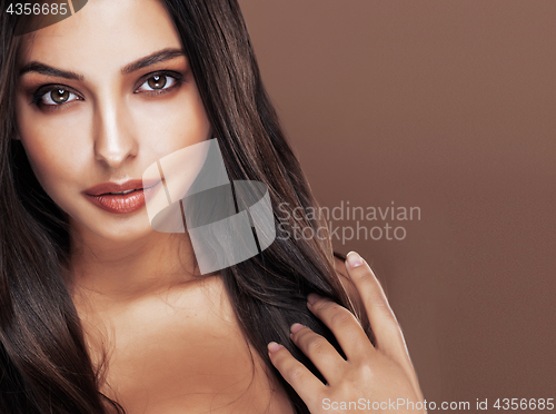 Image of cute happy young indian woman in studio close up smiling, fashion mulatto