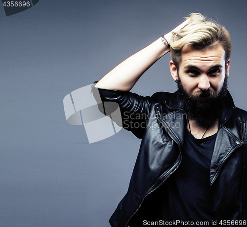 Image of portrait of young bearded hipster guy on gray dark background close up, brutal modern man, lifestyle people concept closeup