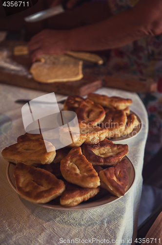 Image of Grandmother bakes pies