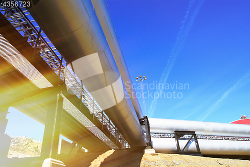 Image of Pipes, tubes, smokestack at a power plant