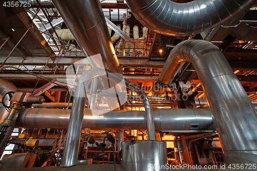 Image of Equipment, cables and piping as found inside of a modern industr