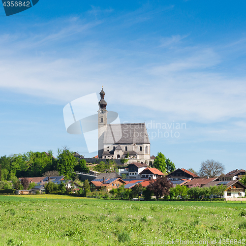 Image of Spring scenery with rural Catholic church and small Bavarian vil