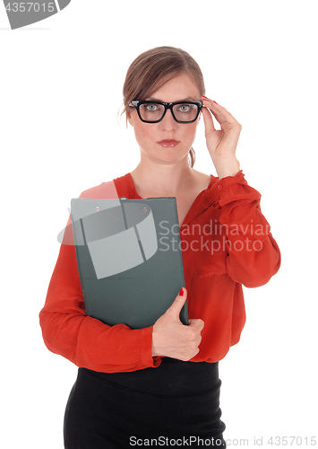 Image of Business woman with glasses holding folder