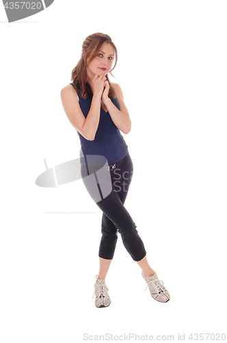 Image of Exercising woman with her hands under her chin