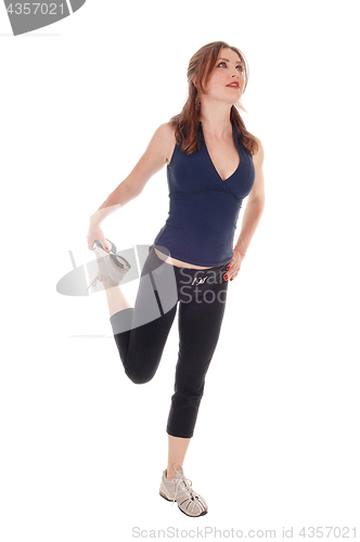 Image of Woman standing in exercising outfit