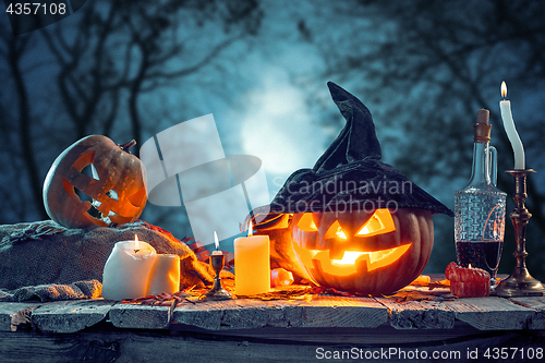 Image of Halloween pumpkins on blue background