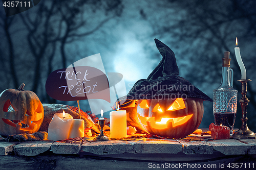 Image of Halloween pumpkins on blue background