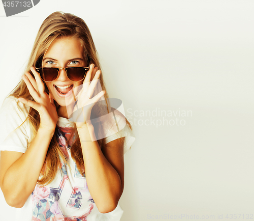 Image of young blond woman in sunglasses smiling close up isolated on white