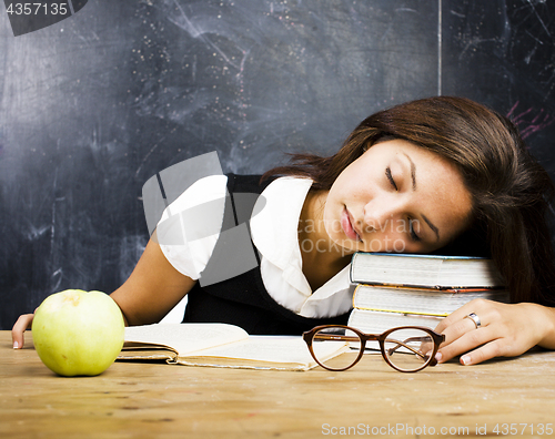 Image of portrait of happy cute real teen student in classroom at blackboard fall asleep
