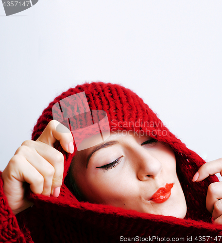 Image of young pretty woman in sweater and scarf all over her face, lifes