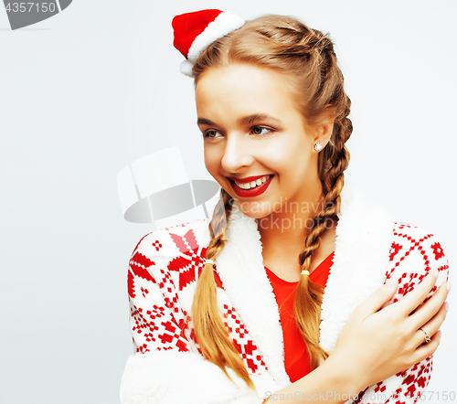 Image of young pretty happy smiling blond woman on christmas in santas re