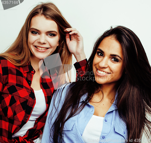 Image of best friends teenage girls together having fun, posing emotional on white background, besties happy smiling, lifestyle people concept, blond and brunette multi nations