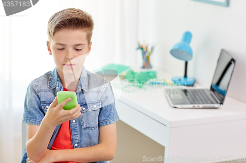 Image of boy with smartphone being bullied by text message