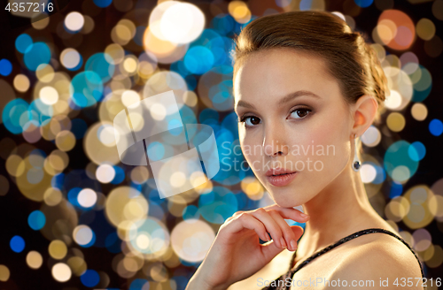 Image of beautiful young asian woman with earring