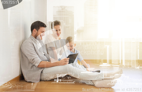 Image of happy family with tablet pc moving to new home