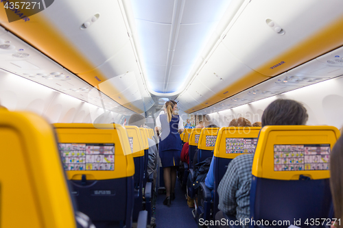 Image of Stewardess serving passangers on Ryanair airplane flight on 14th of December, 2017 on a flight from Trieste to Valencia.