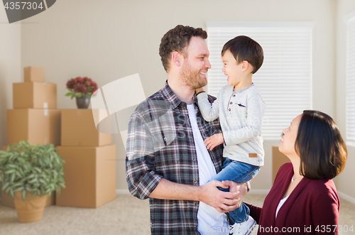 Image of Young Mixed Race Caucasian and Chinese Family Inside Empty Room 