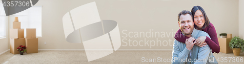 Image of Mixed Race Caucasian and Chinese Couple Inside Empty Room with M
