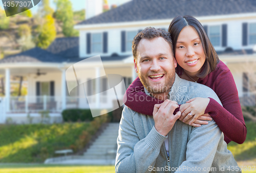 Image of Mixed Race Caucasian and Chinese Couple In Front Yard of Beautif