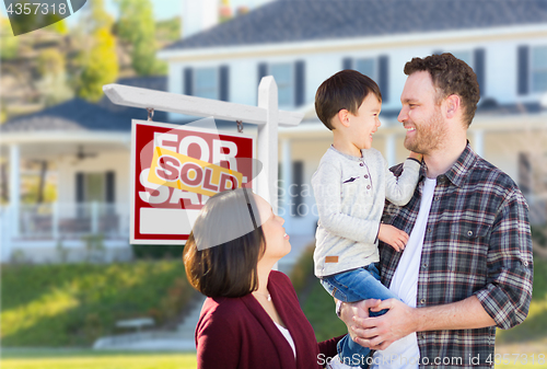 Image of Young Mixed Race Caucasian and Chinese Family In Front of Sold F