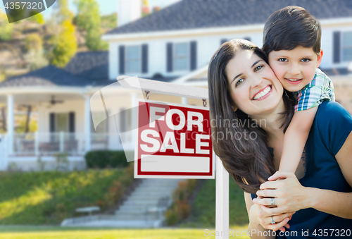Image of Young Mother and Son In Front of For Sale Real Estate Sign and H