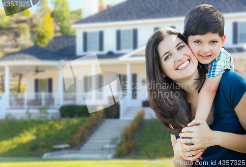 Image of Young Mother and Son In Front Yard of Beautiful Custom House.