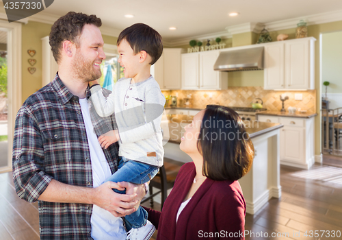 Image of Young Mixed Race Caucasian and Chinese Family Inside Custom Kitc