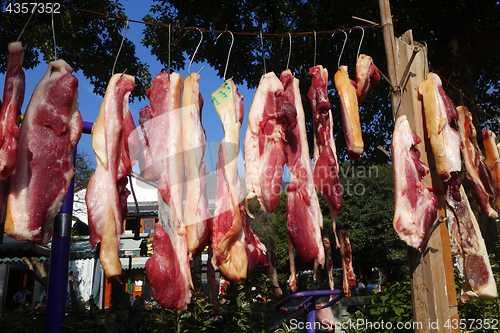 Image of The meat drying outside on the sun