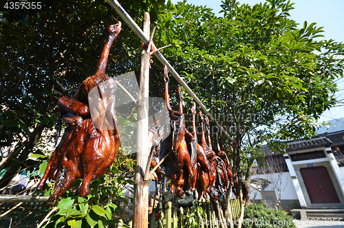 Image of Rows of cured meat hanging to dry