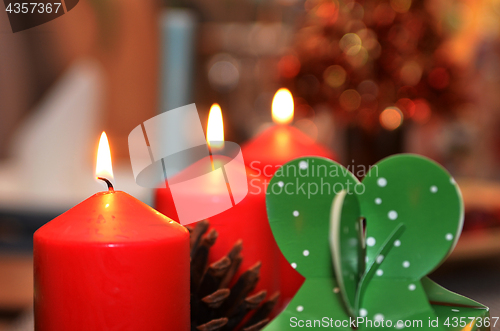 Image of Christmas candle burning at night.