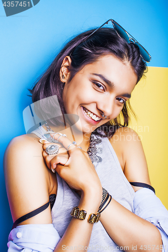 Image of lifestyle people concept. young pretty smiling indian girl with long nails wearing lot of jewelry rings, asian summer happy cool