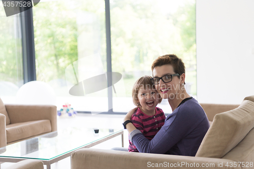 Image of mother and cute little girl enjoying their free time