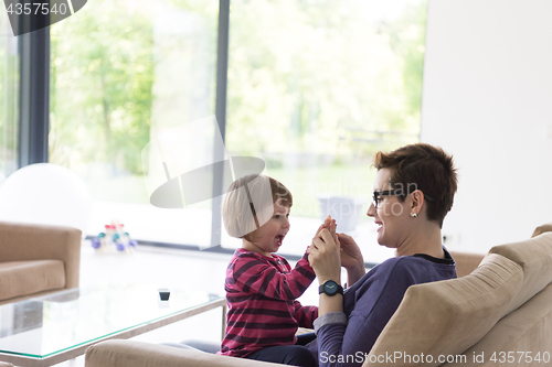 Image of mother and cute little girl enjoying their free time