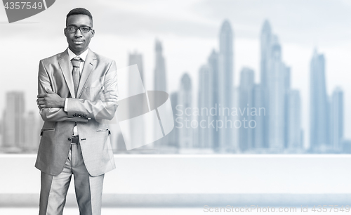 Image of Young black businessman in front of the big city