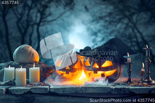 Image of Halloween pumpkins on blue background