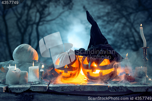 Image of Halloween pumpkins on blue background