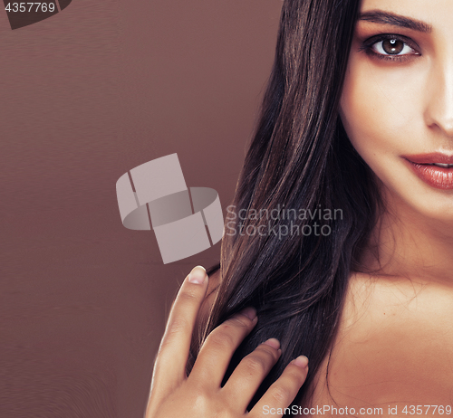 Image of cute happy young indian woman in studio close up smiling, fashion mulatto
