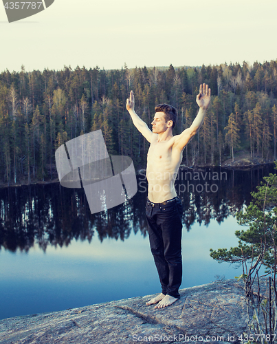 Image of middle age man doing sport yoga on the top of the mountain, lifestyle people outdoor, summer wild nature for training 