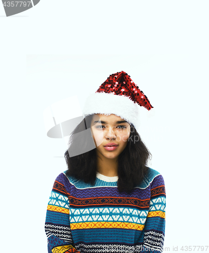 Image of cute young girl in santas red hat isolated