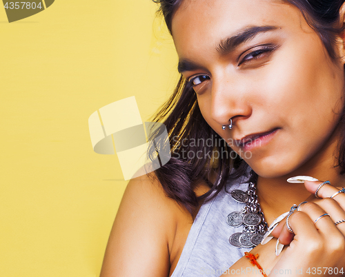 Image of lifestyle people concept. young pretty smiling indian girl with long nails wearing lot of jewelry rings, asian summer happy cool 