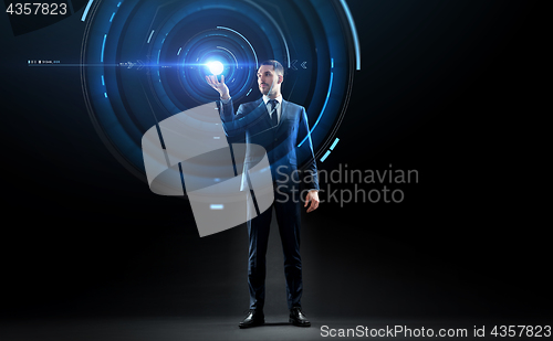 Image of businessman in suit with virtual projection