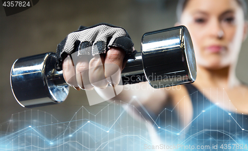 Image of close up of sporty woman with steel dumbbell