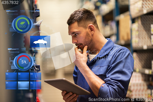 Image of auto mechanic or smith with tablet pc at workshop