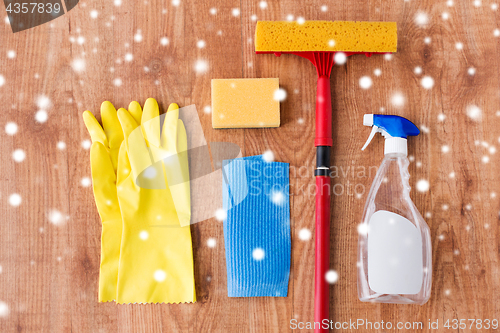 Image of squeegee with window cleaning stuff on wood